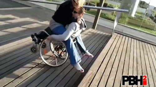 This Couple Having Fun On Wheel Chair