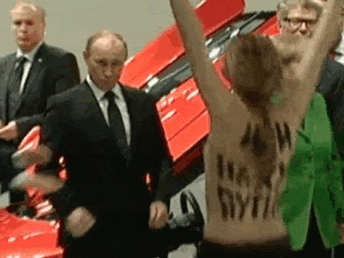 Putin Reacts To A Topless Protester